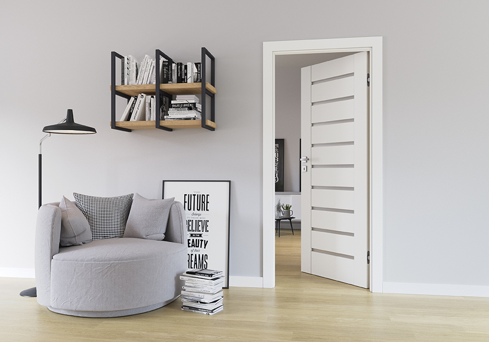Modern, cozy interior featuring a sleek silver door handle on a white panel door, adding a subtle touch of elegance to the minimalist space.