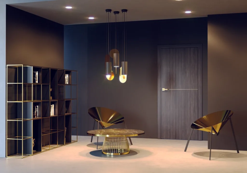 High-quality interior dark wood door with a sleek gold handle, complementing the modern decor and luxurious design of the living area with its elegant and refined appearance.