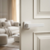 Elegant square internal door handles in a clean matt white finish from the Pina collection, installed on a matching off-white paneled door.