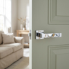 High-shine polished chrome Pina on Square Rosette elegant square internal door handles featuring a mirror-like finish on a light sage green door.