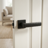 Bold matt black Raflesia on Square Rosette high-end square door handles with a tactile finish, creating a modern contrast on a bright white door.