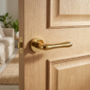 Cynia on Round Rosette in PVD gold, luxury lever internal door handles fitted to a light oak internal door.