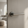 Papavera on Round Rosette in graphite finish, showcasing classic round door handles on a light wood internal door.