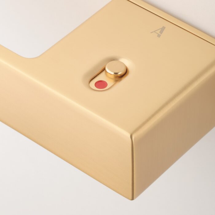 Ludisia Left Hand Lock - Unlocked Close Up Ludisia on Hidden Rosette – matt gold frameless door handle with built-in privacy lock showing red locked indicator.